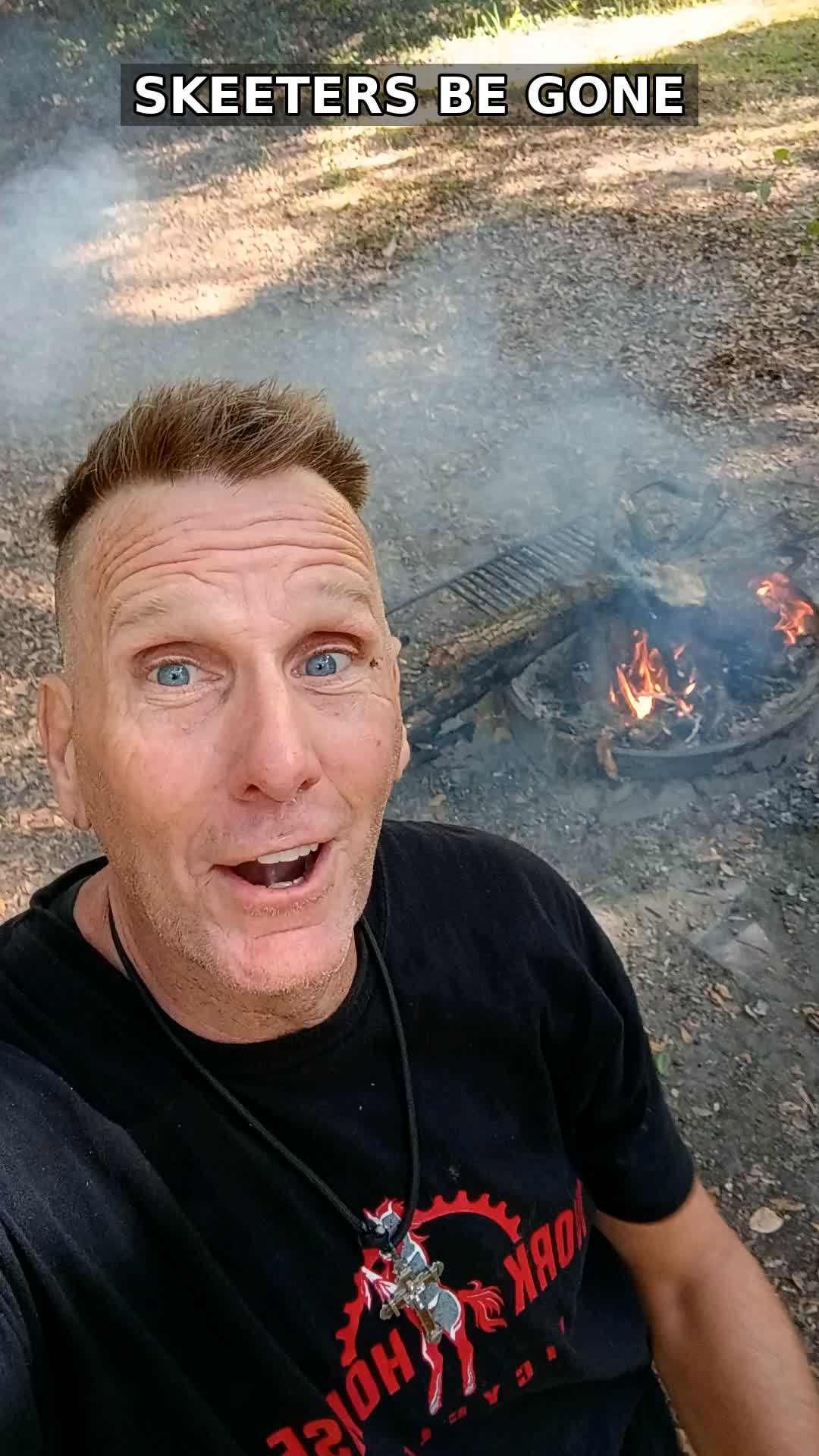 Real photo: Coach RODA at his campfire in the Francis Marion National Forest, Oct 28, 2026 — the smoking fire ring behind him